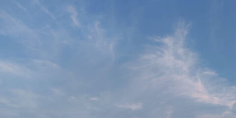 Blue sky clouds background. Beautiful landscape with clouds and orange sun on sky. Panorama top of clouds and blue sky background. Beautiful blue sky with clouds.	
