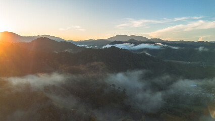 Aerial View of Misty Mountains at Sunrise