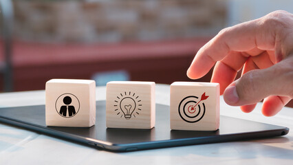 Action plan, objective and target, success and business target concept, project management, and company strategy development stacked wood blocks step on table with icon