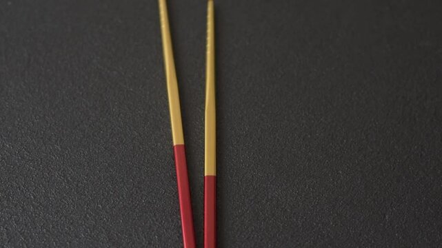 Stick or chopstick Japanese or Chinese for eating sushi, rolls. Metal chopsticks for Asian food