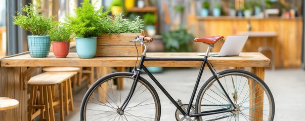 Bike cafe work station setup style. Bicycle beside a wooden table with potted plants in a cozy setting.