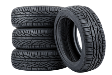 A stack of sturdy, reliable new car tires ready for the open road, showcasing deep tread and a robust design against a bright white background.