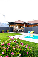 Fototapeta premium modern house with a swimming pool and a beautiful flower