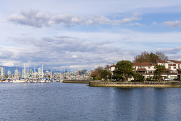 Fototapeta premium Serene Waterfront View of False Creek in Vancouver, BC, with Boats and Sky
