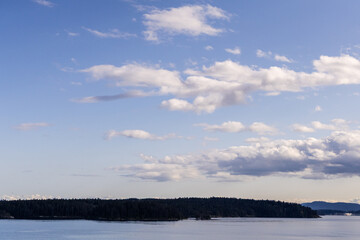 Fototapeta premium Scenic View of a Calm Lake and Cloudy Sky in British Columbia