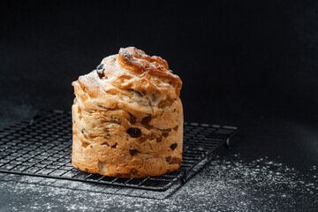 Freshly baked sweet bread on cooling rack sprinkled with flour