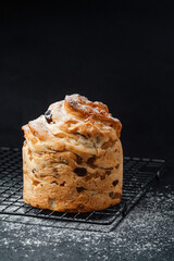 Freshly baked sweet bread resting on a cooling rack in a kitchen setting