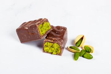 Dubai chocolate bar with crispy kataifi and pistachio paste. Close up