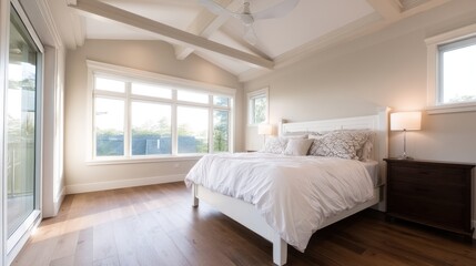 Bright and airy modern bedroom with large windows, showcasing natural light and serene decor