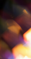 Glare light. Blur iridescent leak. Defocused golden purple yellow multicolor lens flare floating on...