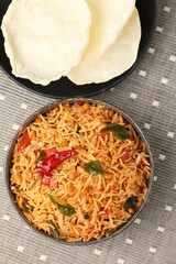 South Indian food Tomato Rice served in a ceramic bowl 