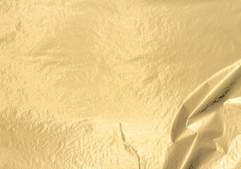 Golden foil background. Elegant, polished texture with subtle shimmer, soft and refined finish. Premium yellow metallic, pearlescent shine, creating a luxurious, chic, decorative vibe. Perfect for.