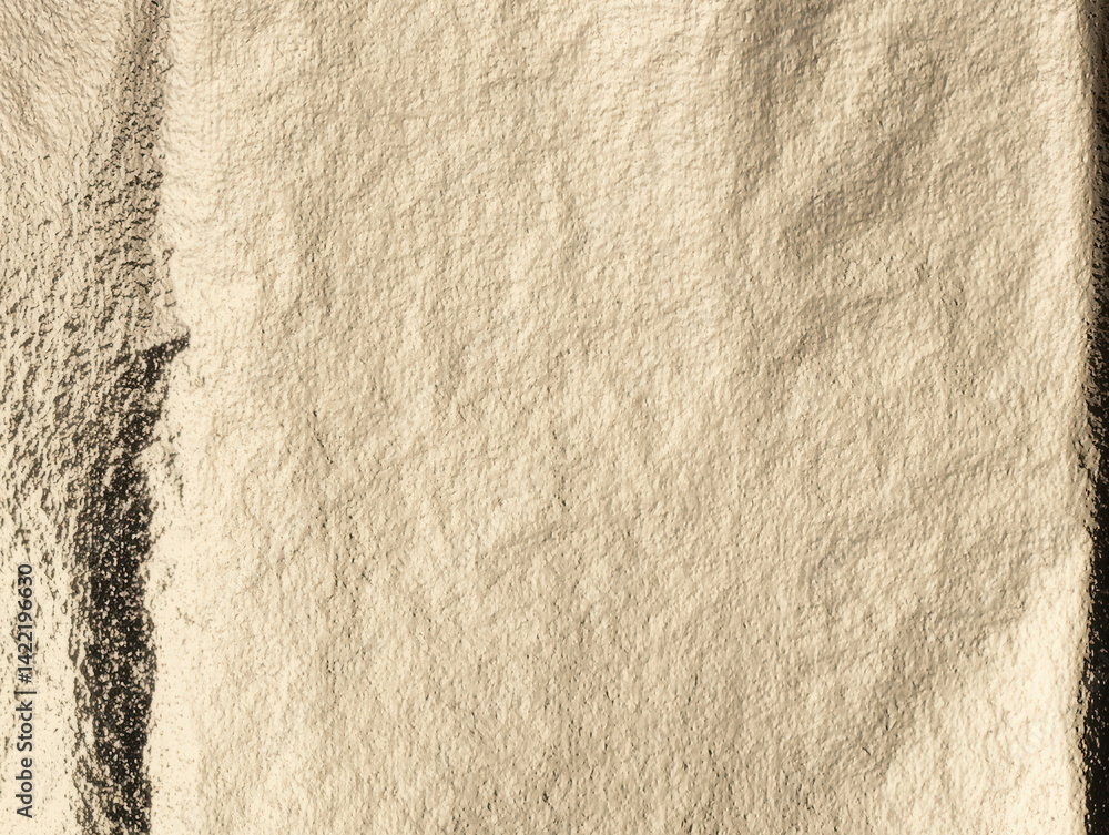 Poster golden foil texture with a crinkled, metallic surface. elegant, smooth pattern with warm light and s