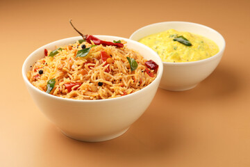 South Indian food Tomato Rice served in a ceramic bowl 