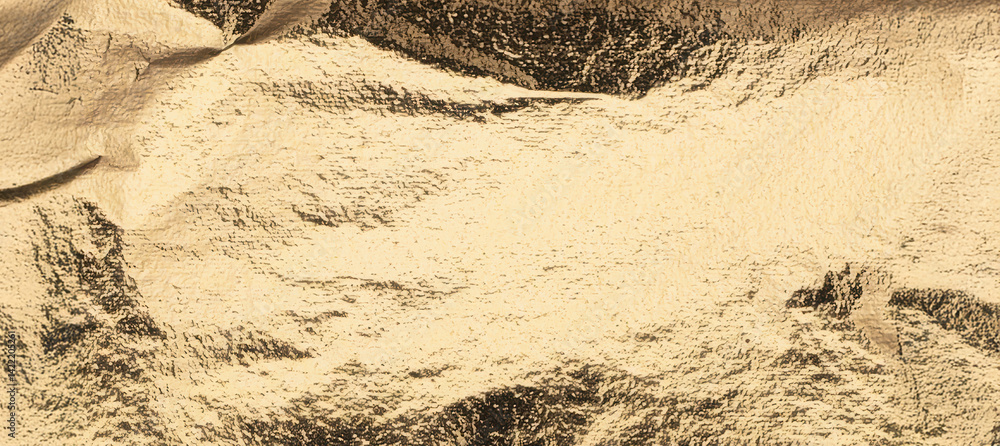 Poster Horizontal golden foil texture with soft crinkles and a brushed shimmer. The elongated format makes it perfect for headers, banners, and elegant backgrounds in modern visual design..