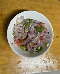 Mix Vegies Salad with onion, tomatoes, cumcumber and green coriander in abowl focus