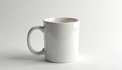 Fototapeta premium Single white ceramic coffee mug on plain white background. Simple design, perfect for drink, beverage, tea, coffee branding. Clean minimalist style, studio shot, blank copy space for text, logo,