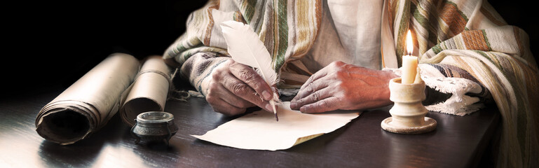 Male hand witn big quill