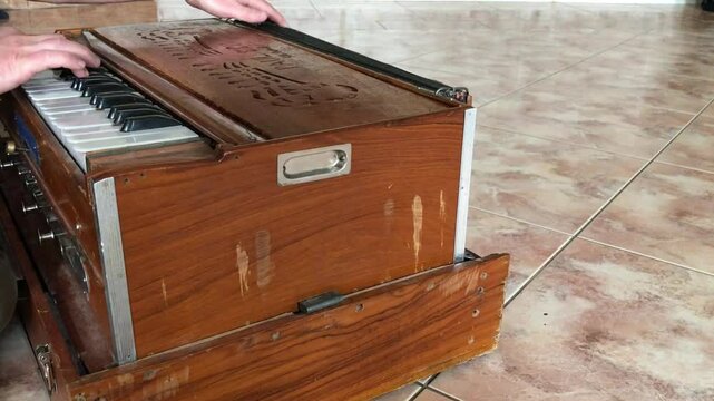 An old harmonica on the tiled floor