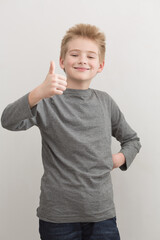 Boy showing thumbs up