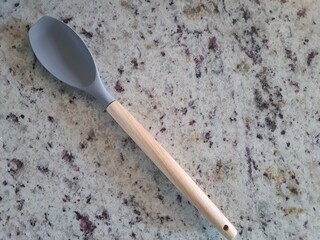Silicone spoon with bamboo handle.