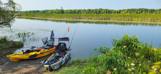 Crown land unmanaged boat ramp water access and Fishing pedal kayaks. PDL Drive fishing kayaks prepared for the launch and fishing at the lake.