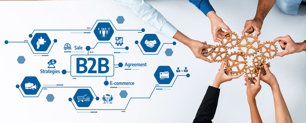 Diverse hands come together to create a collaborative partnership for B2B e-commerce solutions,...