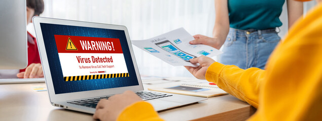 Virus warning alert on computer screen detected brisk cyber threat , hacker, computer virus and...