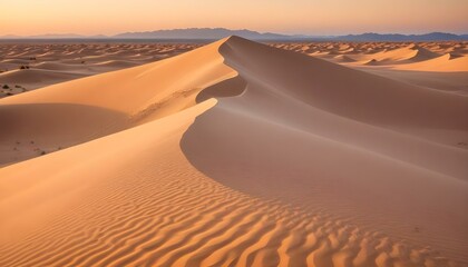 A breathtaking sunrise over the endless desert dunes, displaying a warm, inviting landscape.