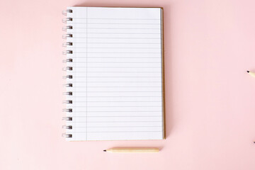 Notebook on the table. Blank notebook with space for a message. Pens, headphones