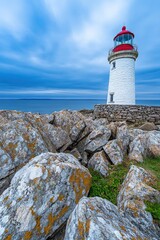  lighthouse on rocky shore to help ships navigate and know when shore is near