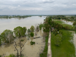 Aerial view capturing the flooded Po River in Emilia Romagna, Italy, revealing submerged fields,...