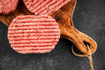 Raw meat cutlets pork, beef, lamb dish fresh delicious gourmet food background on the table rustic...
