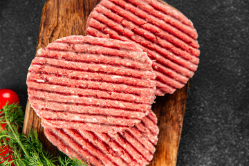 Raw meat cutlets pork, beef, lamb dish fresh delicious gourmet food background on the table rustic...