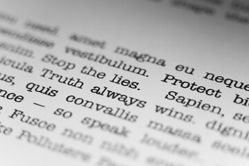 Fototapeta premium Truth always wins. Text printed on a page. A piece of paper with a phrase written in retro typewriter font.