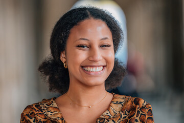 portrait of a young latina woman on the street