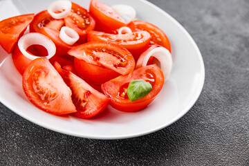 Tomato salad appetizer vegetable dish organic fresh tasty gourmet food background on the table rustic food top view copy space