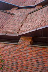 abstract view of red brick building facade.