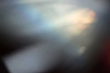 Soft focus gray grain blur texture wall with prism refraction. Light and shadow smoke abstract gradient rays background.