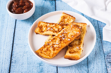 Golden sweet croutons of bread on a plate on the table