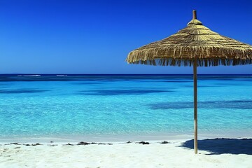 Serene Tropical Beach Scene with Thatch Umbrella