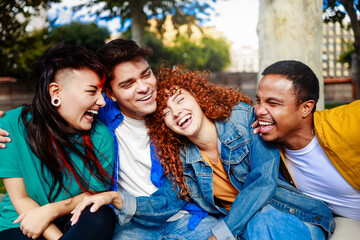 Diverse group of friends have fun at city park festival. Happy people in summer holiday party together. Youth community lifestyle