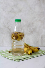 Banana peel water in plastic bottle for plants fertilizing and gardening