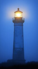 Luminous Lighthouse in Misty Twilight