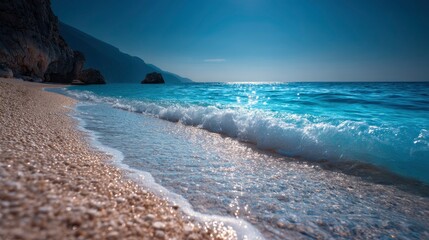 Coastal Serenity: Sparkling Waves on a Sandy Beach