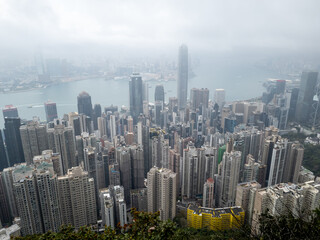 Obraz premium Hong Kong. China- 03.01.2025. A high angle view of the Central city skyline covered in heavy mist from the Lugard Road Lookout on the Peak.