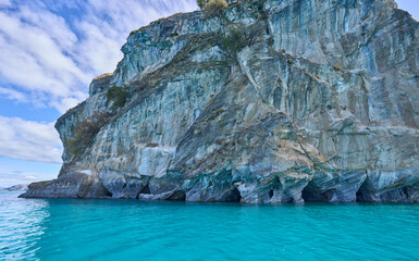 Marble Caves, the most beautiful natural sight in General Carrera Lake in Chile. Surreal rock formations. Curved walls covered in unique patterns. Reflected blue light from turquoise water. Boat tour.