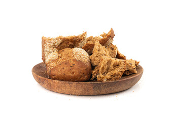 Broken wheat brown bread pieces isolated, fitness pumpkin carrot buns with seeds, cereal bread