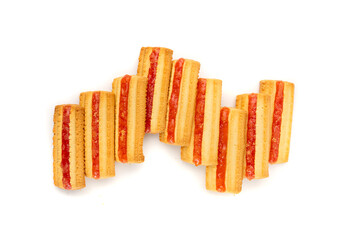 Shortbread sticks with a jam strip isolated, biscuit cookies with fruit marmalade or jelly on white