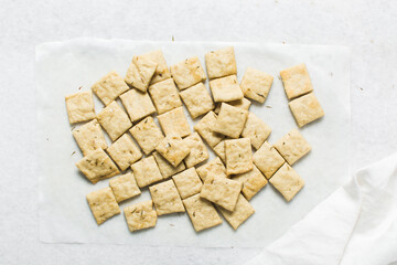 Overhead view of homemade crackers, top view of freshly baked cracker biscuits, process of making crackers